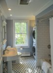 Bathroom with tub-shower and laundry